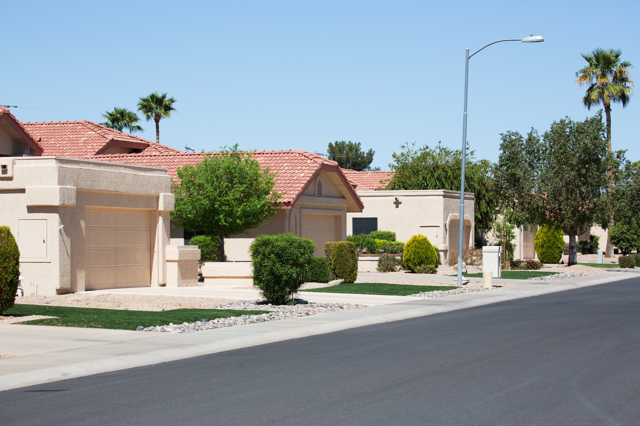 Suburban street with modern homes and landscaping